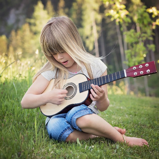 How should kids learn to play the guitar?